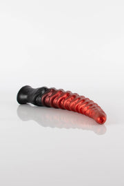 A product photo of  tentacle dildo lying down.