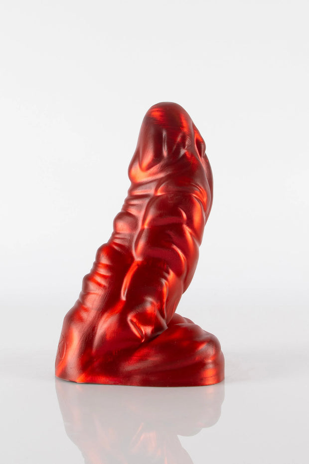 A product photo of a red dragon dildo taken from the side.