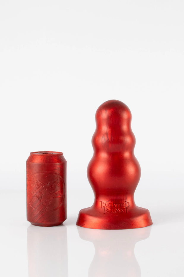 A size comparison photo of a large red bubble butt plug. 