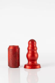 A size comparison photo of a small red bubble butt plug. 