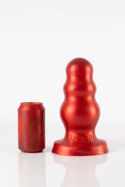 A size comparison photo of a XL red bubble butt plug. 