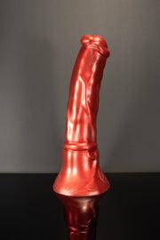 A product photo of a red horse dildo stood up.