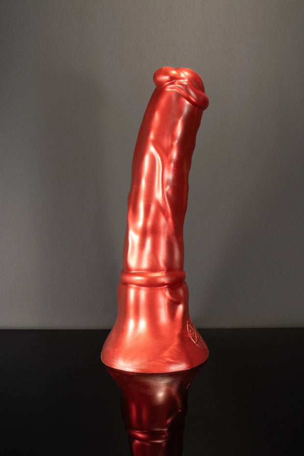 A product photo of a red horse dildo stood up.