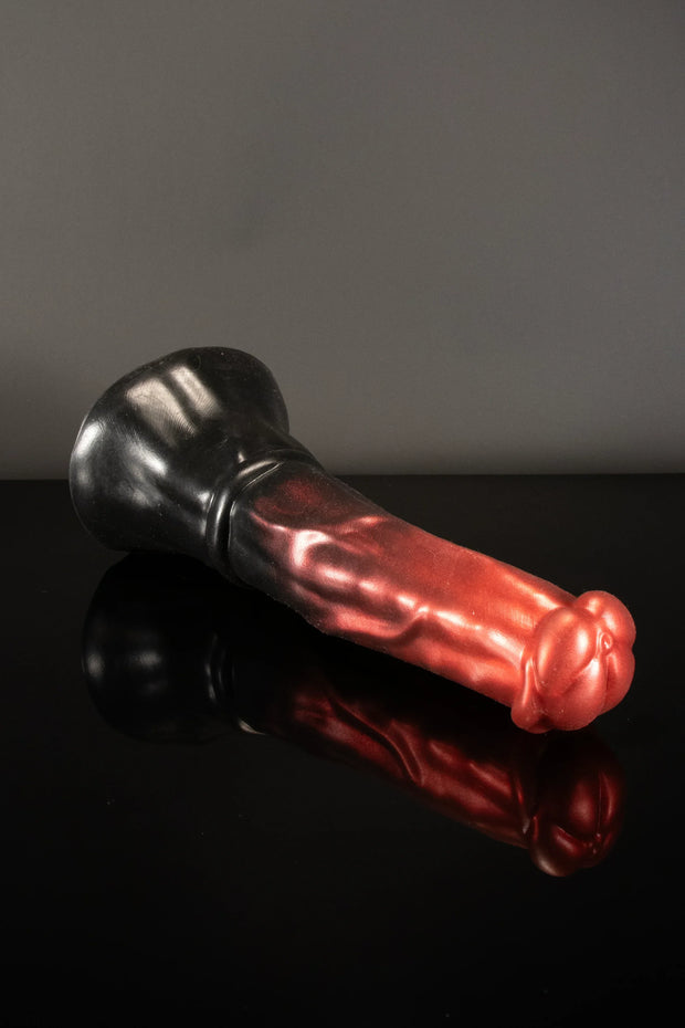 A product photo of a horse dildo lying down.