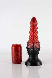 A large tentacle dildo by Twisted Beast next to a can for size comparison.