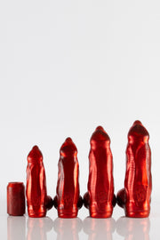 A line up of four red demon dildos for a size comparison. 