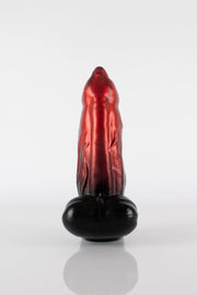 A product photo of a demon dildo standing up.