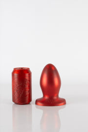 A 8.5 inch red silicone butt plug.