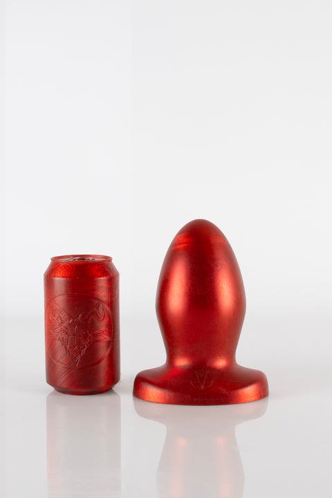 A 9.5 inch red silicone butt plug.