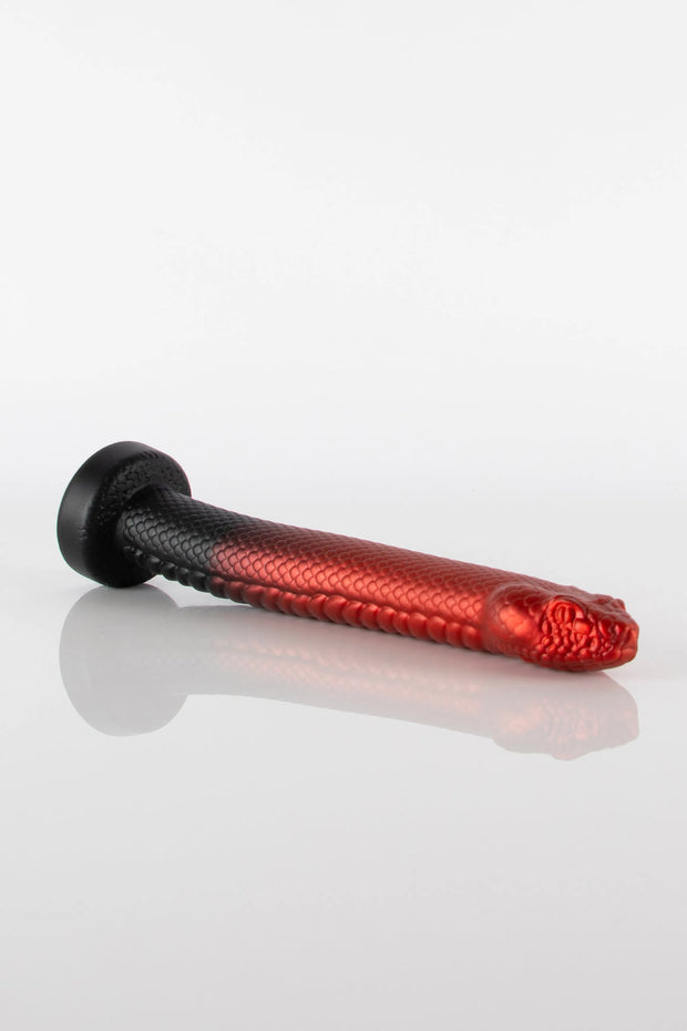 A product photo of a snake dildo going from black to red in colour.