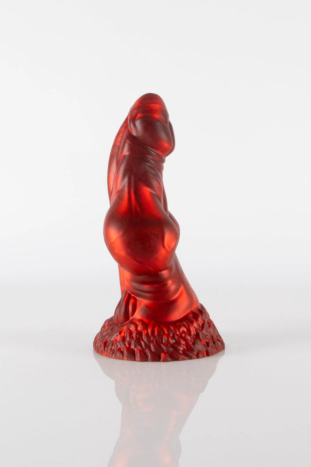 A side photo of a red fox dildo.