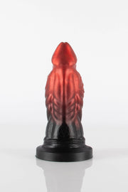 A product photo of a reptile dildo taken from the back showing of a pentagram.