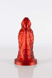 A product photo of a red demon dildo taken from the front showing off the toy's ridges.